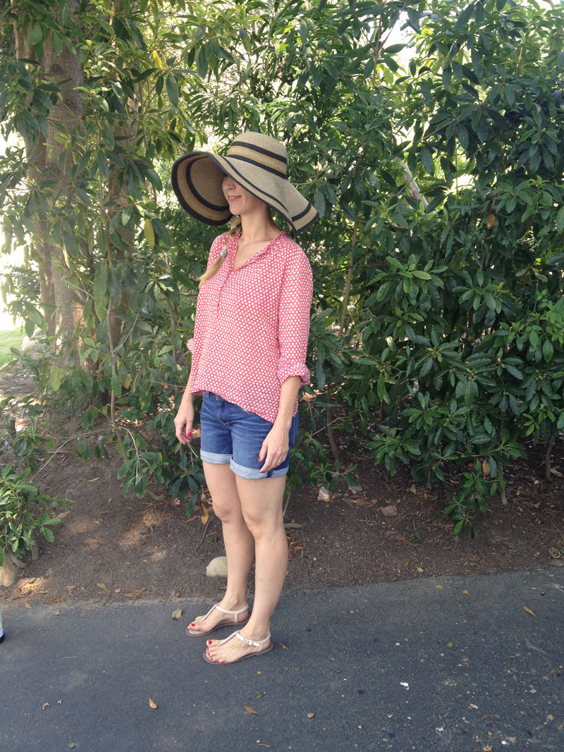 getting ready to head to the beach. top is isabel marant. sun hat and denim shorts are from anthropologie. jellies are fendi.