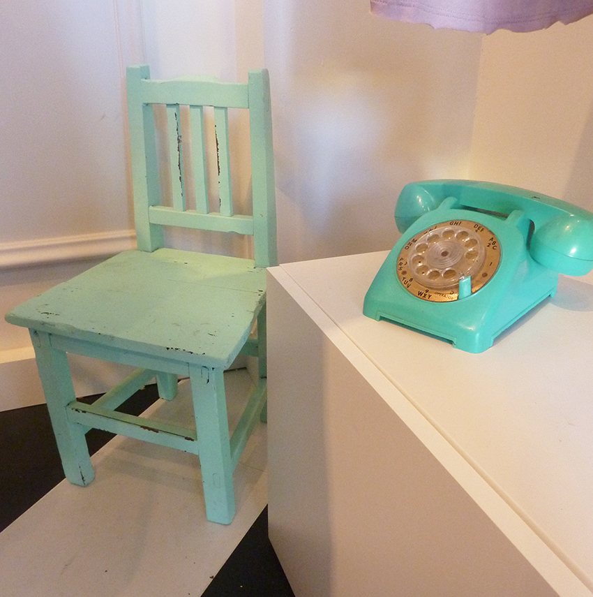 mint rustic painted chair and matching telephone at sweet threads long beach store opening