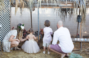 visiting the chicken coop in our family photo session | the love designed life