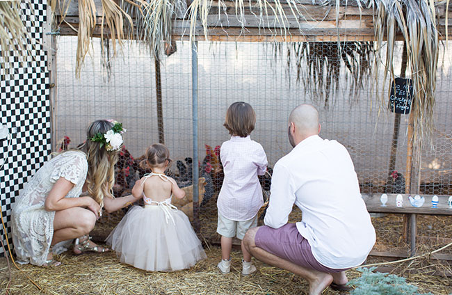 visiting the chicken coop in our family photo session | the love designed life