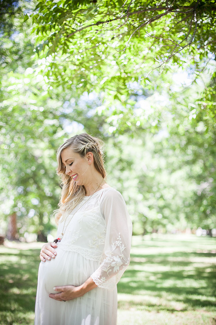 a baby bump in a pecan grove | the love designed life