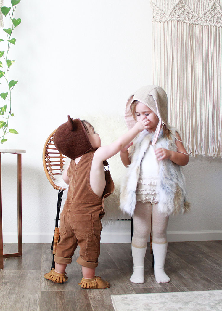 trying to play with sister's bunny nose | baby halloween costume ideas on thelovedesignedlife.com