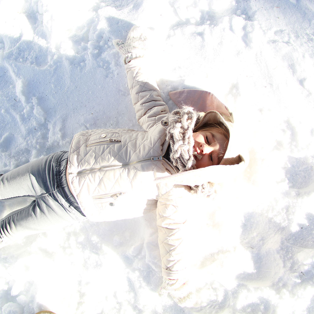 snow bunny making a snow angel | thelovedesignedlife.com