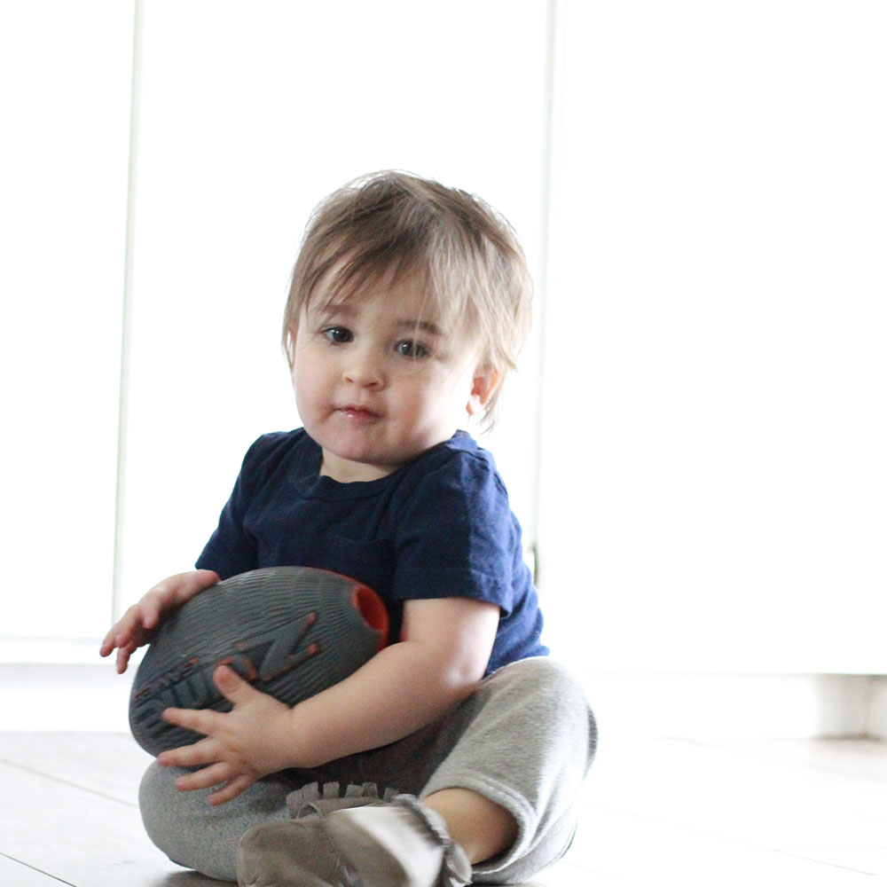 sweet boy on a floor cleaned by a robot named bObi. | thelovedesignedlife