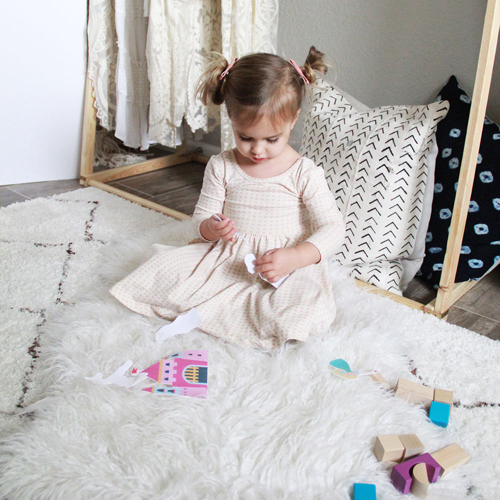 playing with her felt dolls from her mom 'n tot box this month | thelovedesignedlife.com