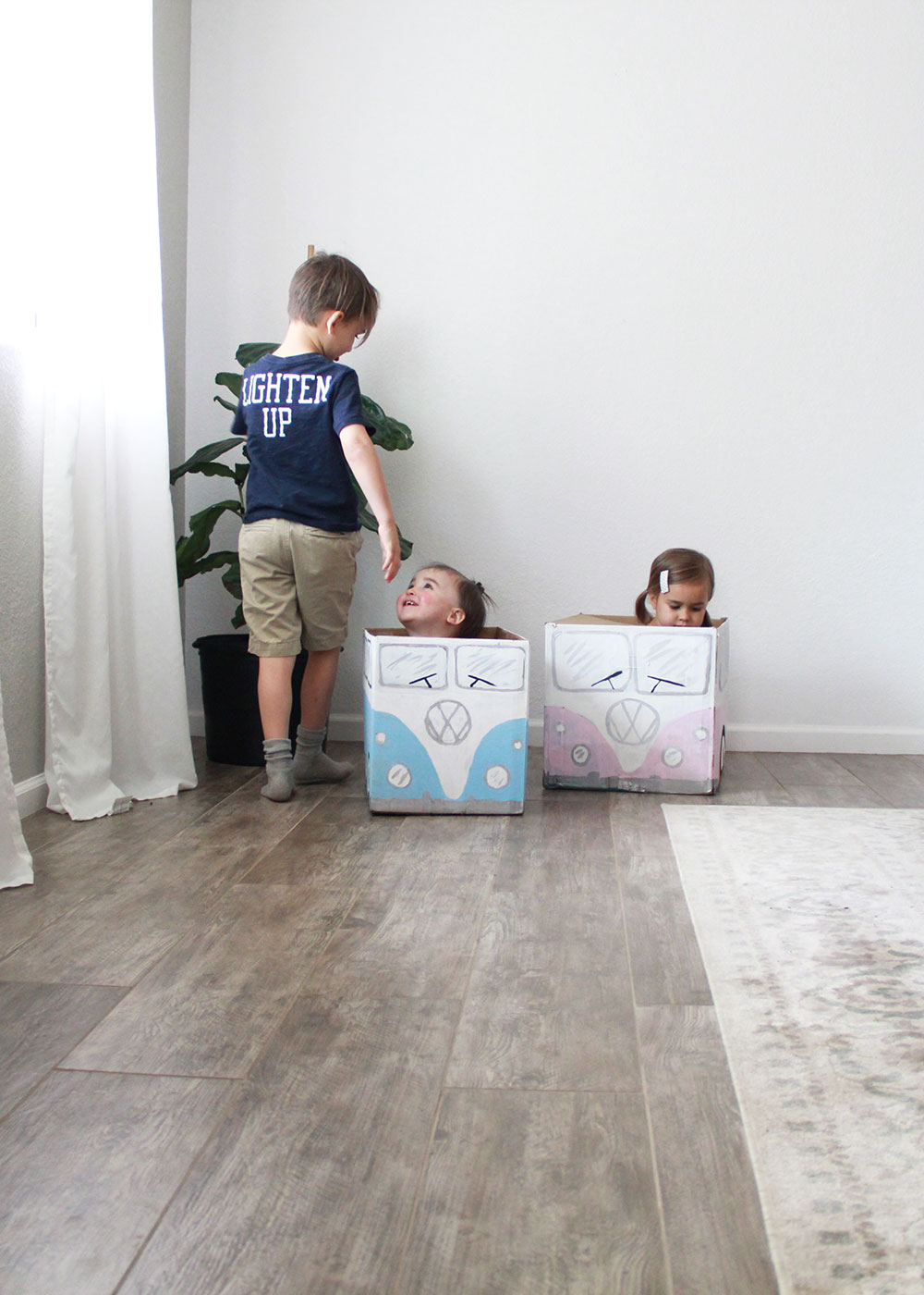 big brother helping with the cardboard box car races | thelovedesignedlife.com