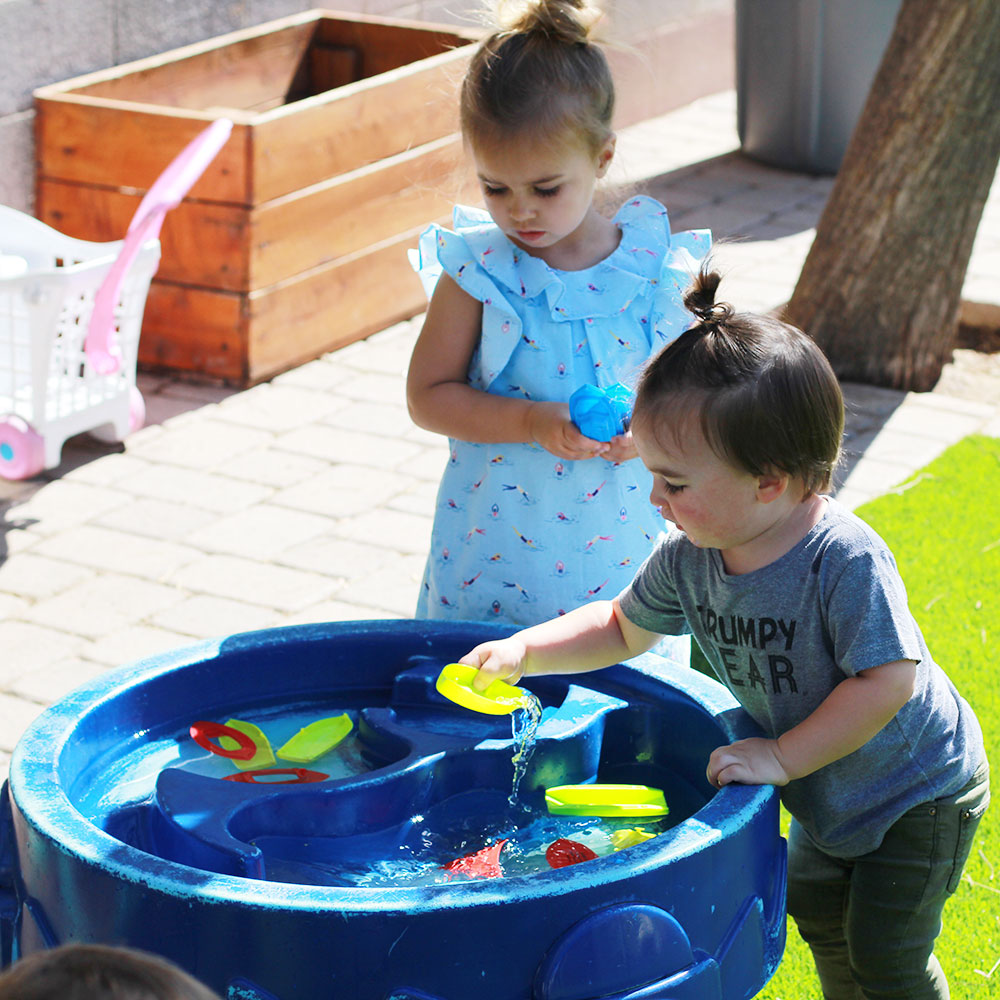 playing at the water table at our local KidsPark drop-in childcare | thelovedesigendlife.com