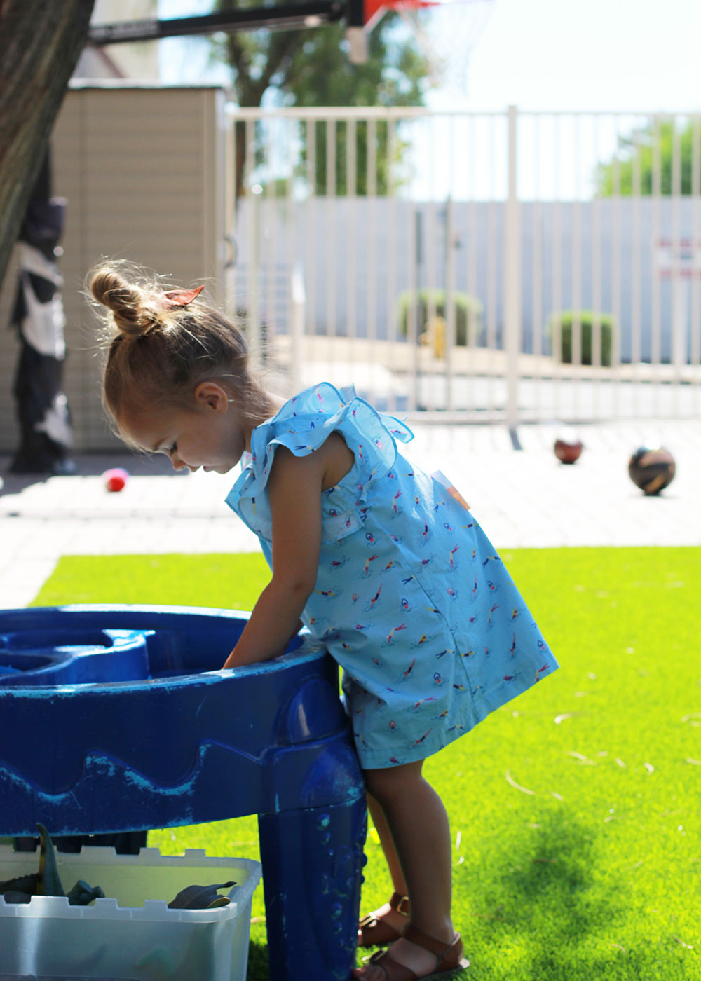 my girl playing at the water table at our local KidsPark | thelovedesigendlife.com