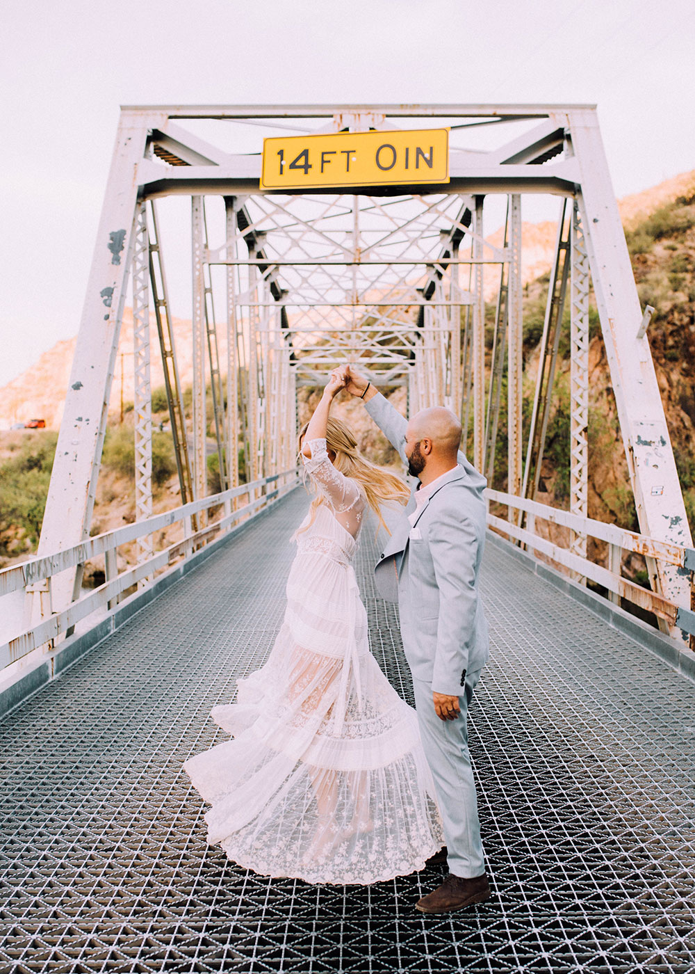 romantic boho wedding anniversary photos on a bridge | thelovedesignedlife.com