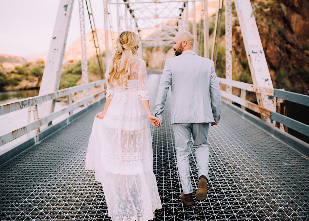 romantic boho wedding anniversary photos on a bridge | thelovedesignedlife.com