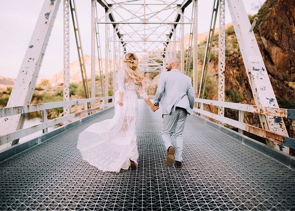 romantic boho wedding anniversary photos on a bridge | thelovedesignedlife.com