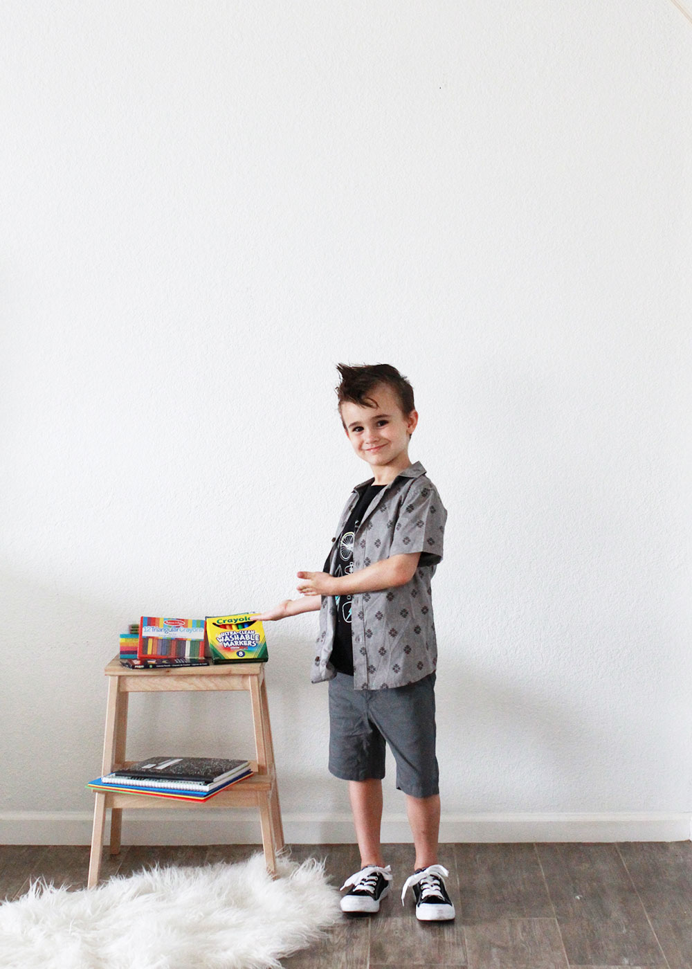 this cool kid checking out all his school supplies for back to school | thelovedesigendlife.com