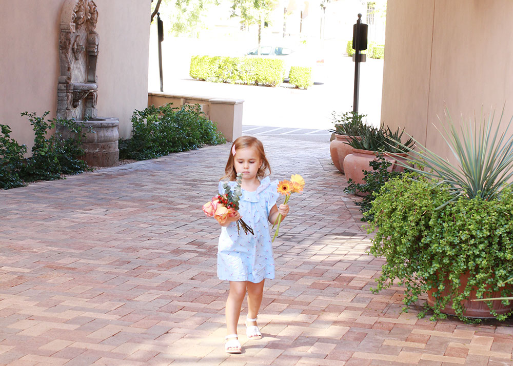 sweet little girl sorting her flowers | #themomblogcollective thelovedesignedllife.com