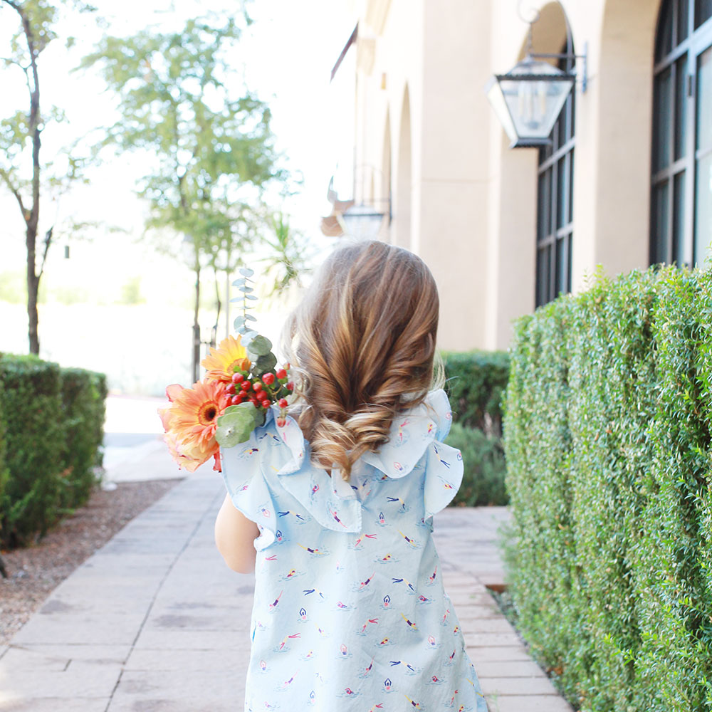 perfect little girl curls and pretty flowers. | #themomblogcollective week 2: building your community and defining your brand | thelovedesgnedlife.com