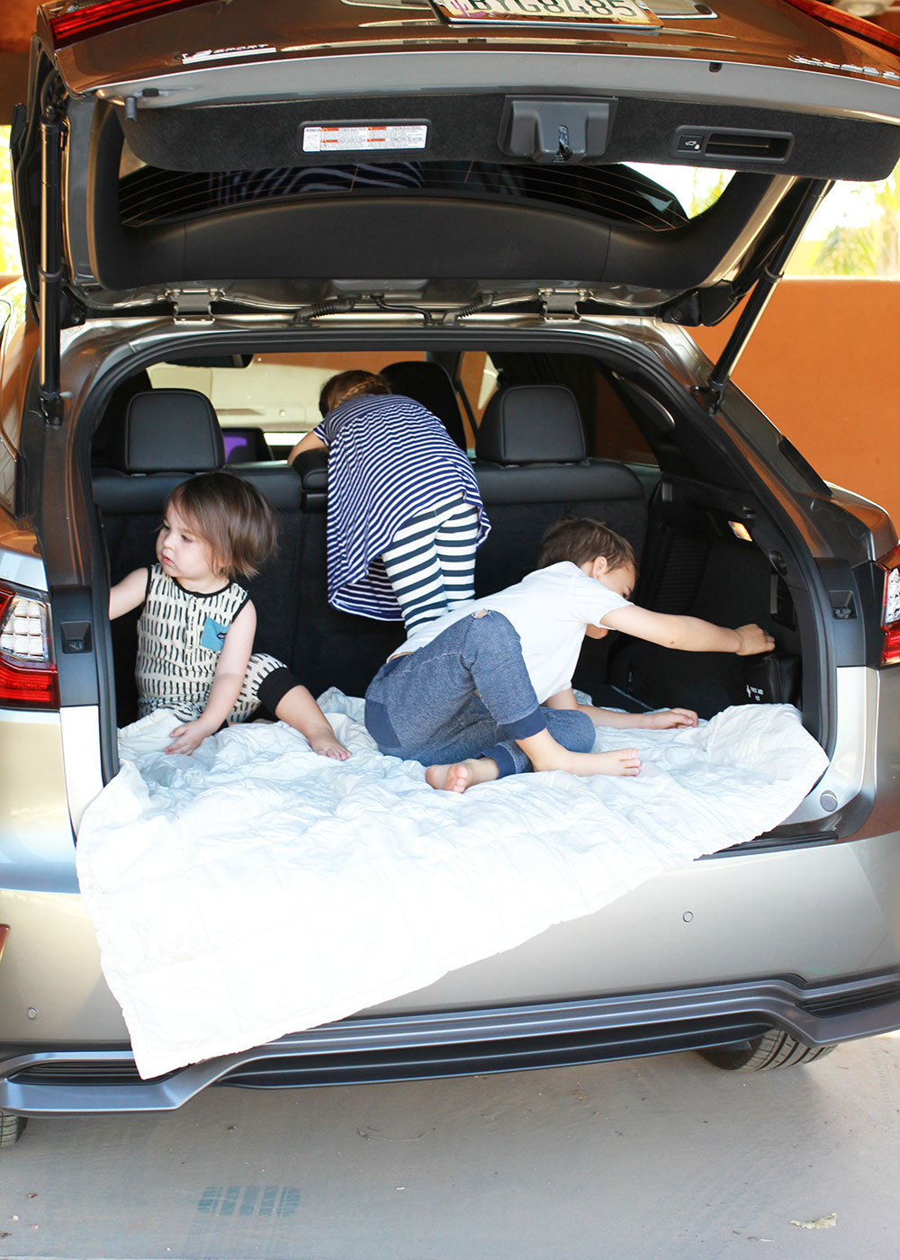 my kiddos checking out this Lexus RX | thelovedsignedlife.com