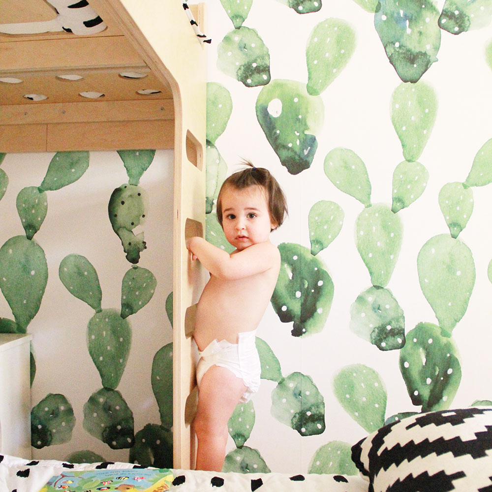 cutest little trouble maker climbing his brother's bunk bed by the cactus wallpaper | thelovedesignedlife.com