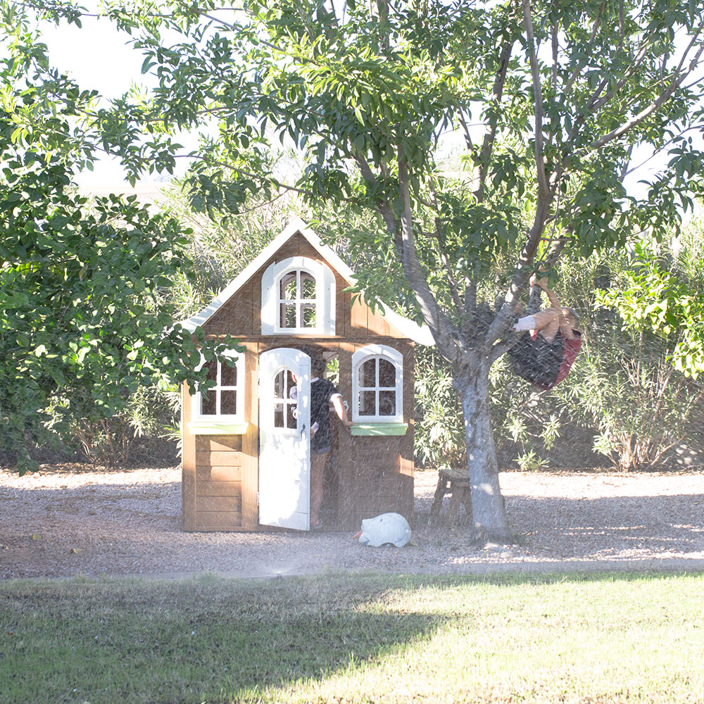 I try to make time to play with my kids every day. This cute playhouse in our backyard is one of their favorite things to do | thelovedesignedlife.com