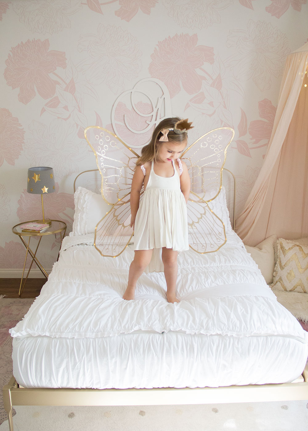 this little fairy girl is loving her super easy beddy's bedding for her new big girl room! | thelovedesignedlife.com