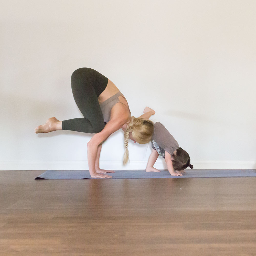 my littlest one 'helping' me with my yoga practice at home | thelovedesignedlife.com