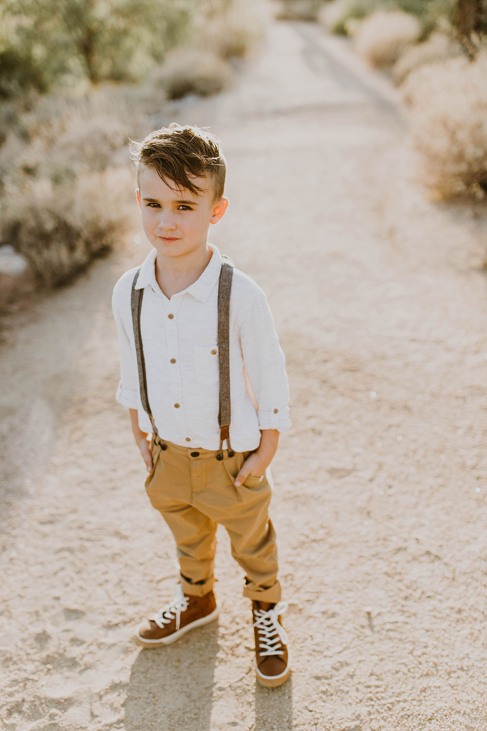 handsome young man in his suspenders #familyphotos #boysclothes #outfitideas | thelovedesignedlife.com