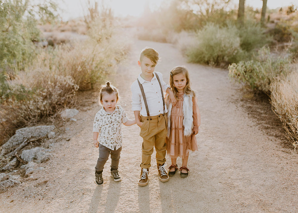 I love non-smiling photos sometimes. #familyphotos #siblinghoodlove #manbun #desertfamilyphotos | thelovedesignedlife.com