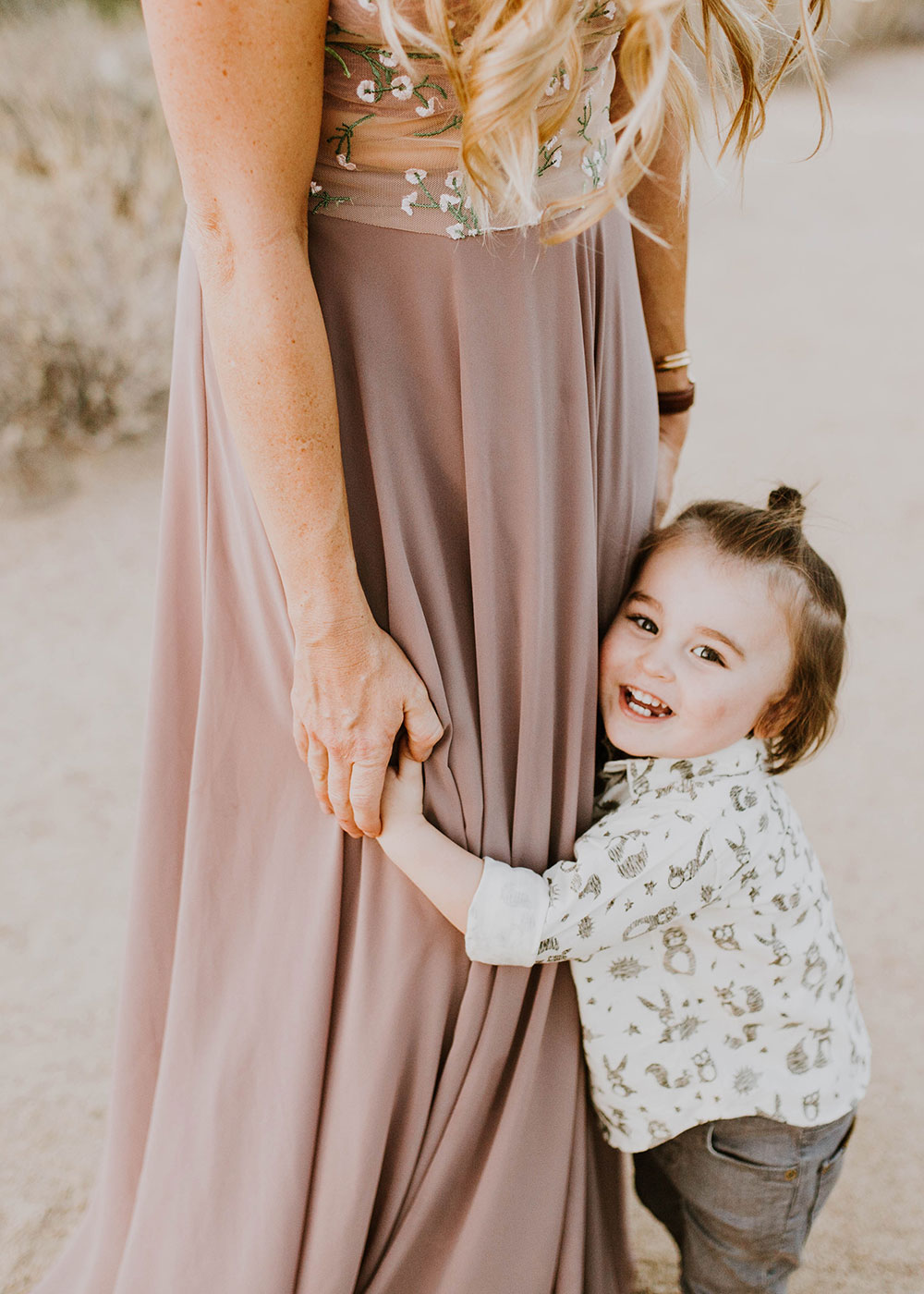 hugs for mama from this sweet toddler boy. #manbun #familyphotos #mamasboy | thelovedesignedlife.com