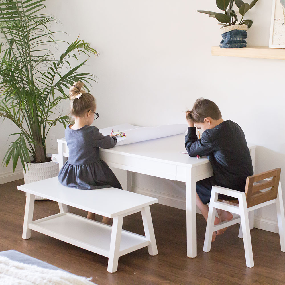 love these two little bookworms hard at work at their play table | thelovedesignedlife.com #newyearsgoals #kidstable #kidsactivities