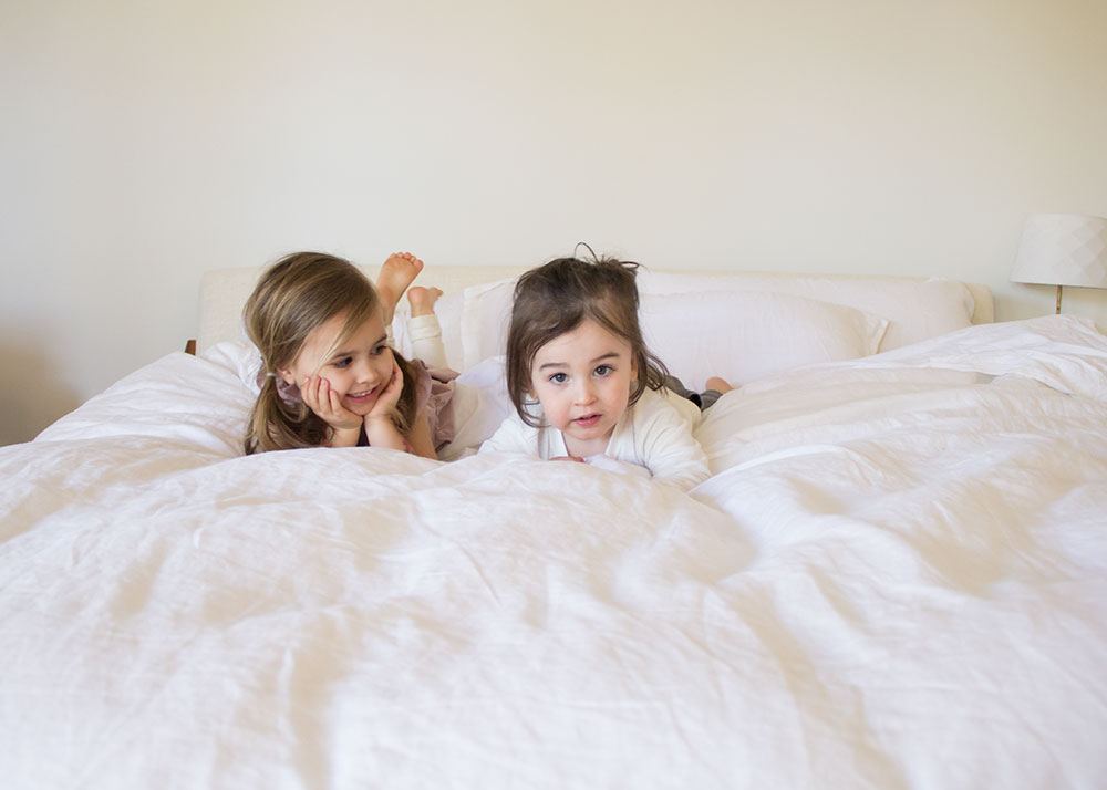 my babies testing out our new master bedroom super soft bedding | the lovedesignedlife.com #thecompanystore #softestbedding #masterbedroom