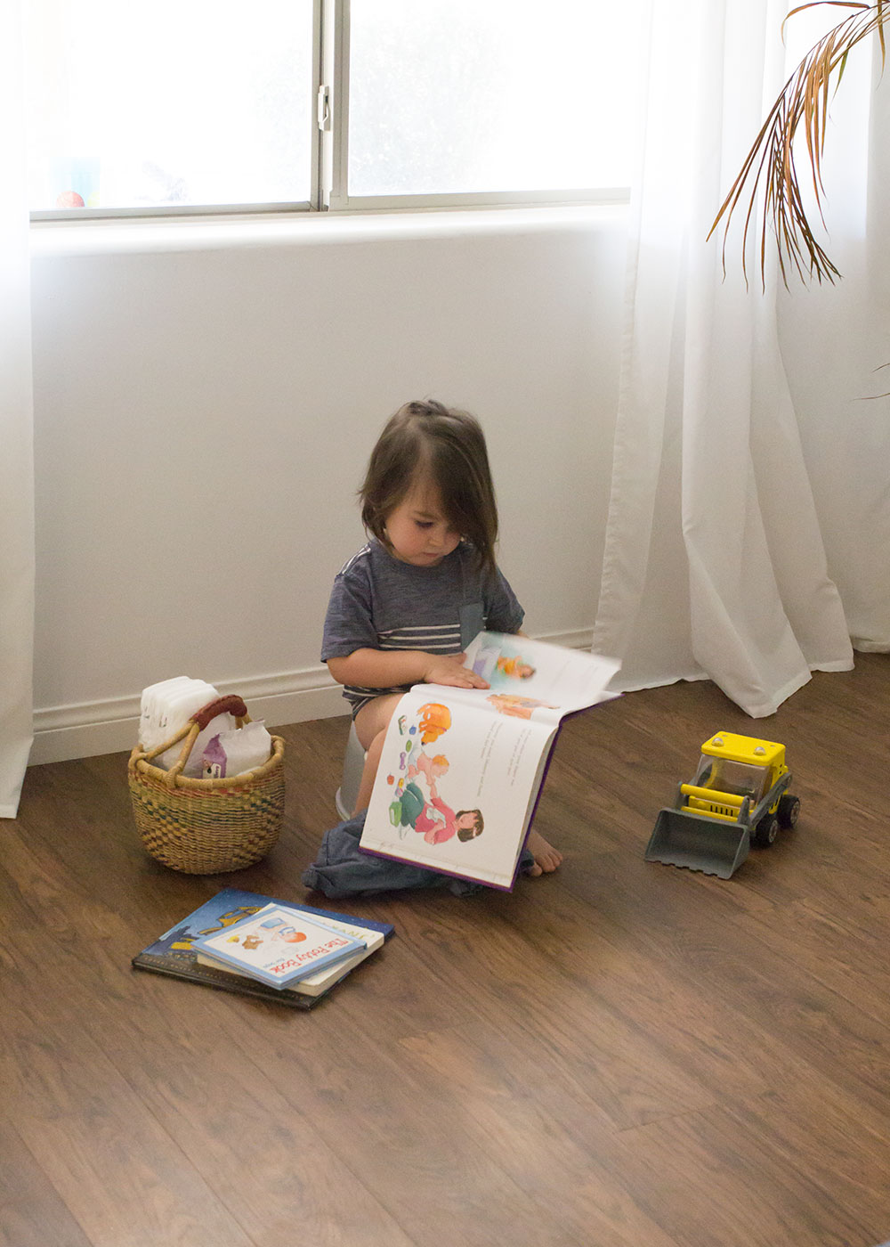 working on potty training with this little toddler by putting the little potty in our living room | thelovedesignedlife.com #pottytraining