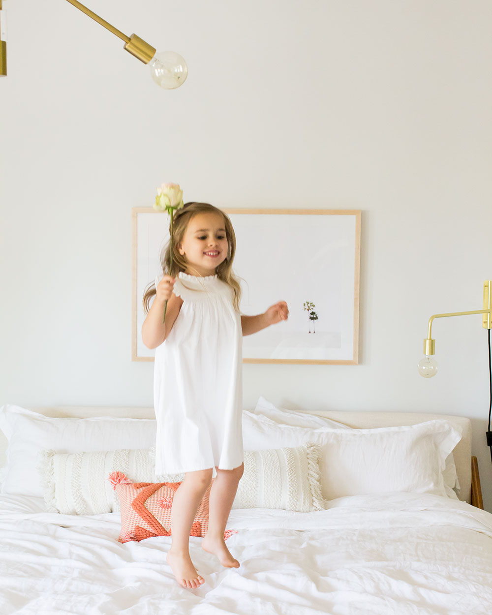 jumping for joy in our master bedroom reveal | thelovedesignedllife.com #theldlhome #masterbedroom #childhood