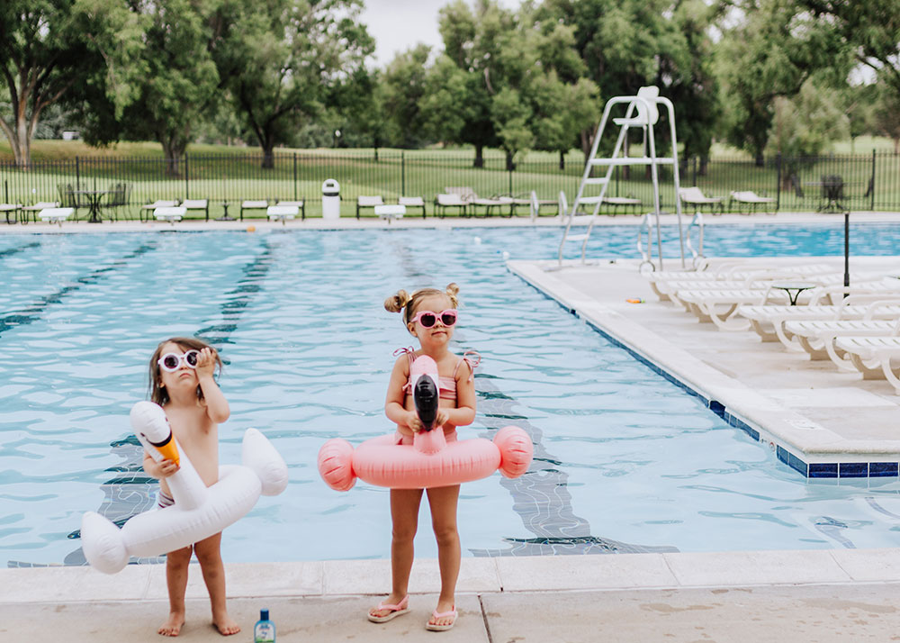 these two and their swan and flamingo floats are ready to jump in the pool! | thelovedesignedlife.com #summerready #bluelizardaustraliansunscreen #naturalsunscreen