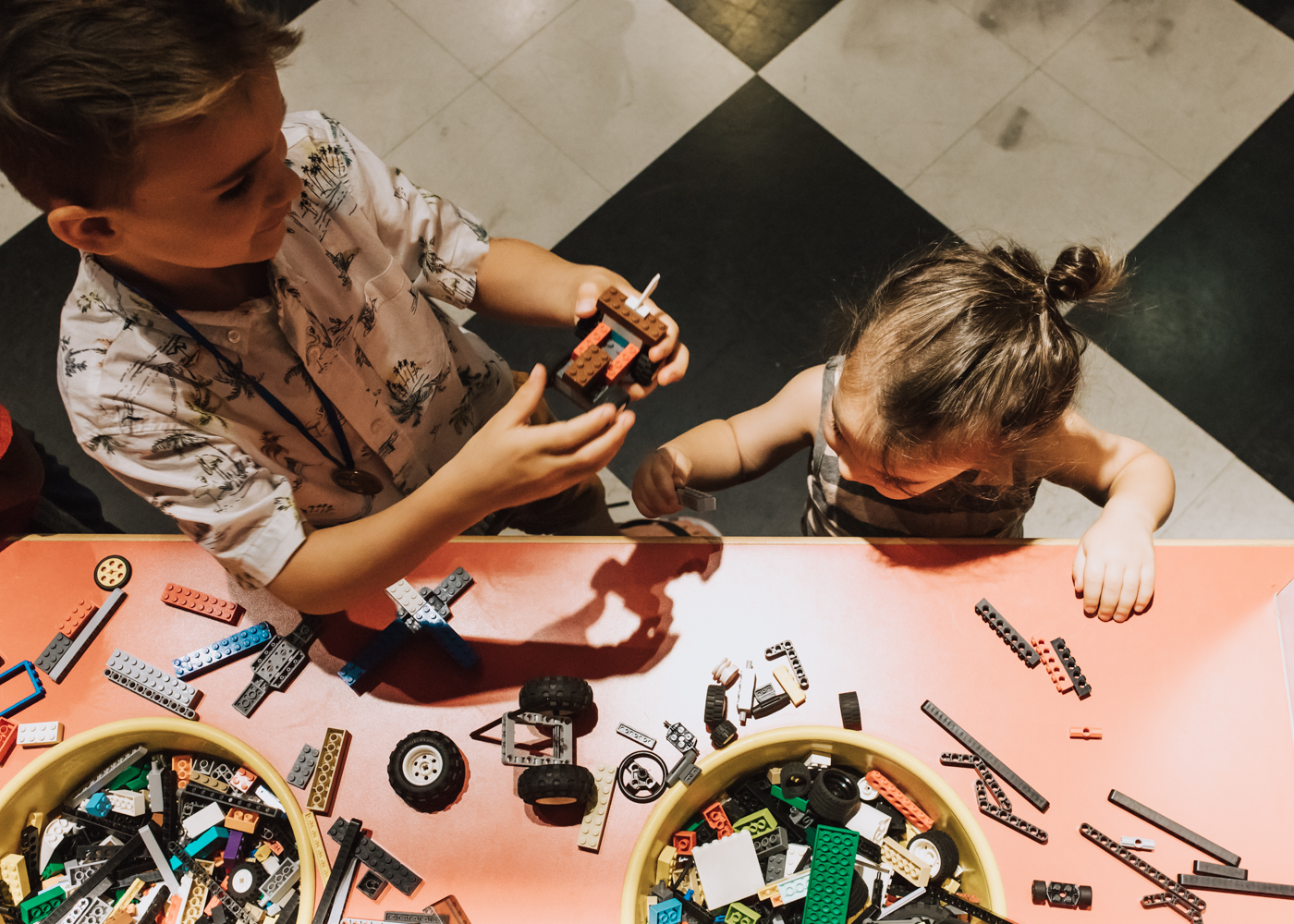 the kids building cars to race on the track at LEGOLAND Discovery Center Arizona | thelovedesignedlife.com