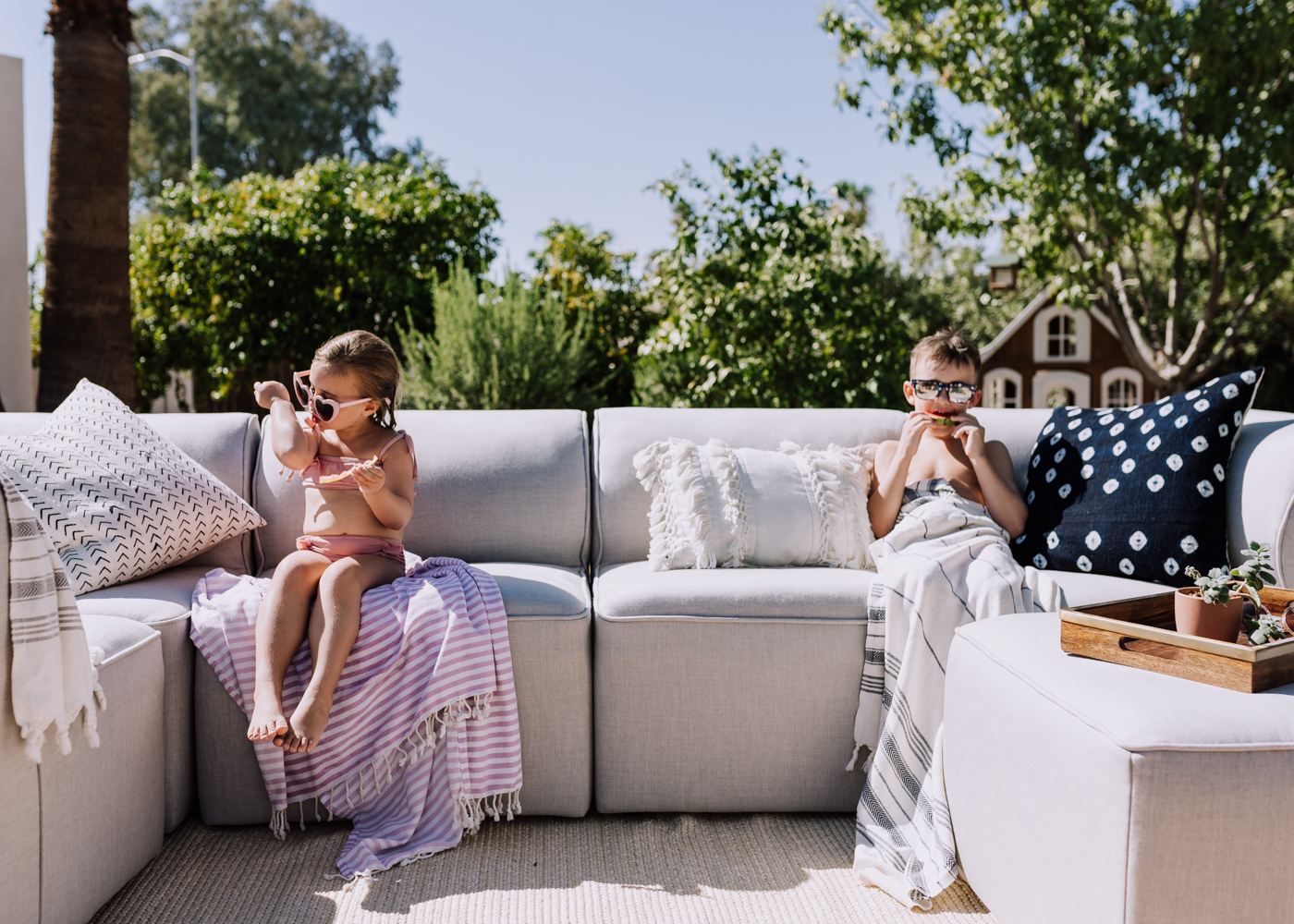 watermelon in the backyard with our new outdoor sofa | thelovedesignedlife.com #summertime #watermelon #childhood