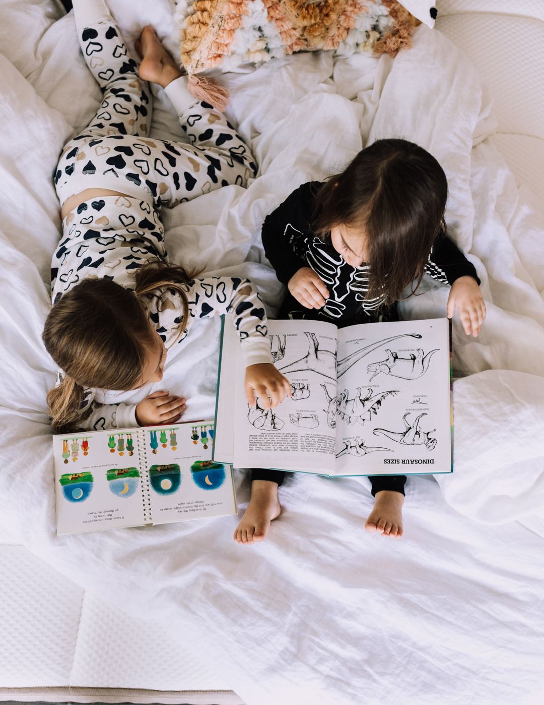 reading together in bed, one of our favorite bedtime rituals | thelovedesignedlife.com #bedtimerituals #dreamcloudsleep