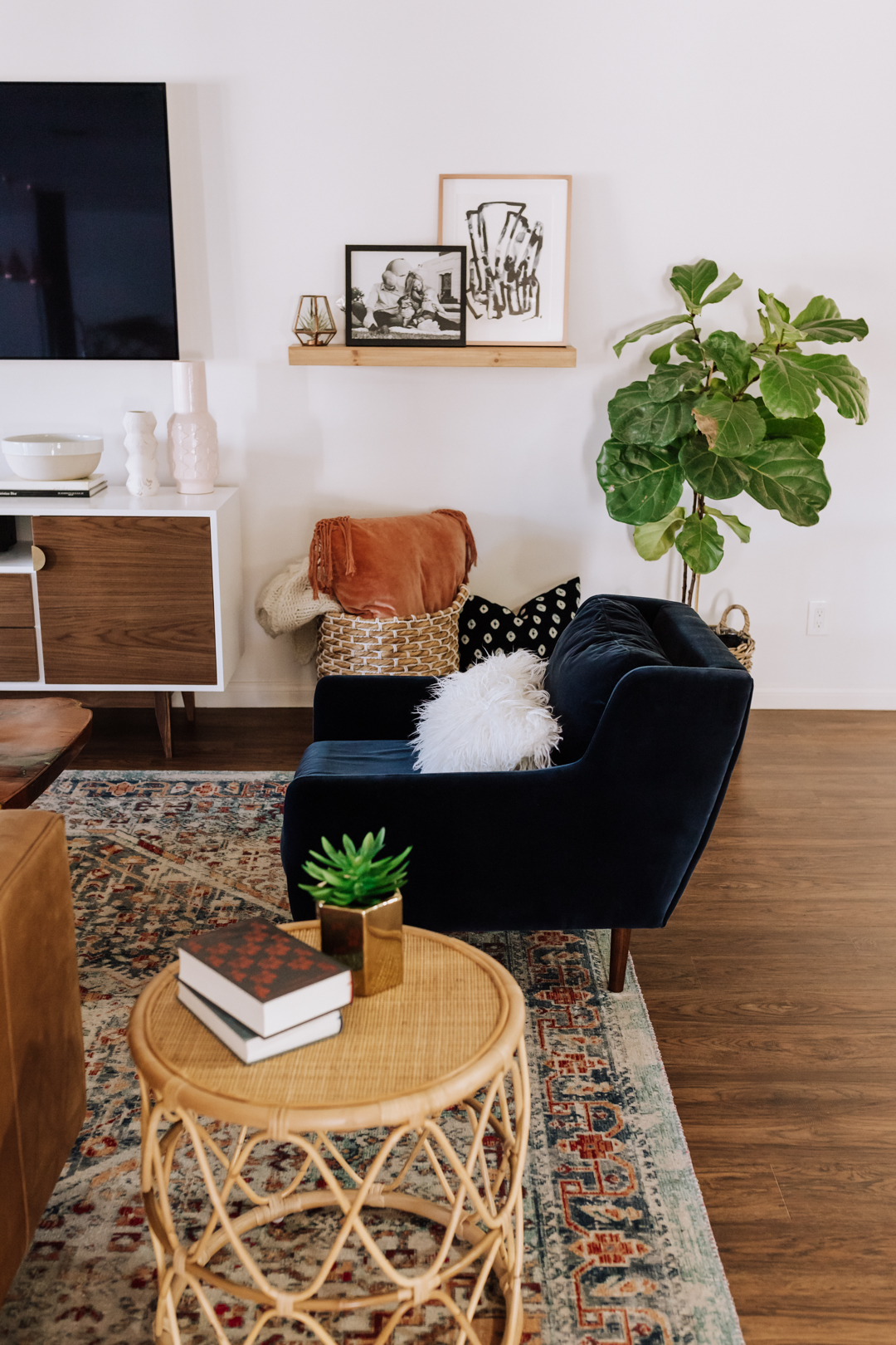 this comfy dark blue velvet lounge chair is a favorite spot in the living room | thelovedesignedlife.com #livingroom #velvetchair #article #afamilyhome #theldlhome