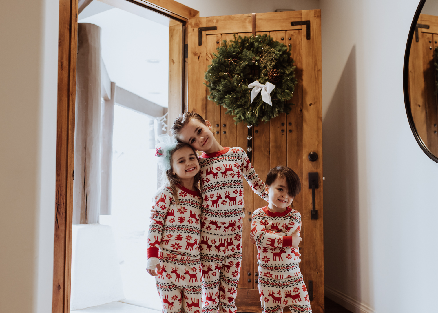 ready for their christmas party guest to arrive! | thelovedesignedlife.com #gingerbreadhouseparty #gingerbread #christmas #christmasjammies #matchingjammies #hannajams