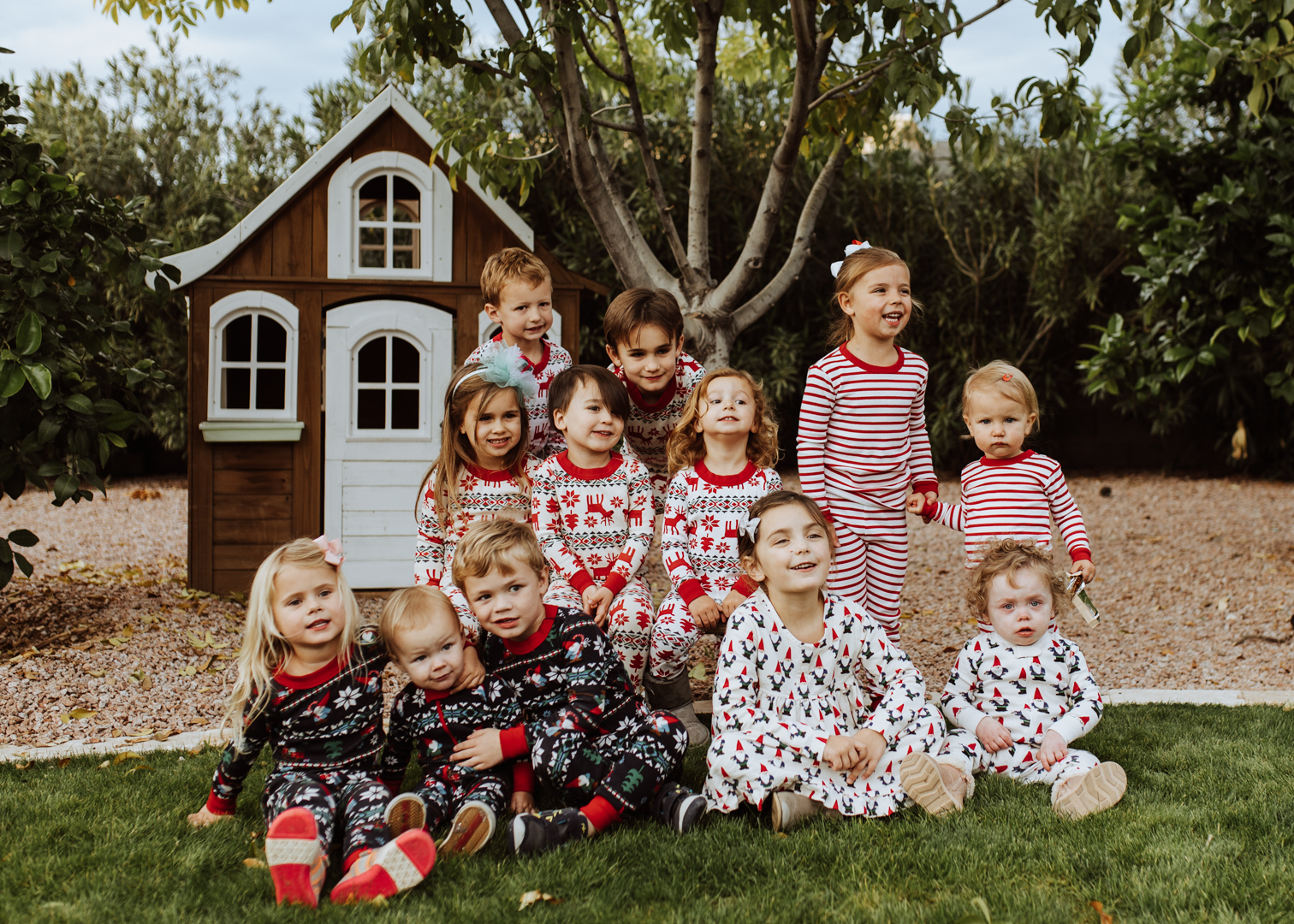 some of my besties kids, all in matching christmas pajamas for our gingerbread decorating party! | thelovedesignedlife.com #matchingjammies #christmasjammies #hannajams #gingerbreadhouse #holidayplaydate