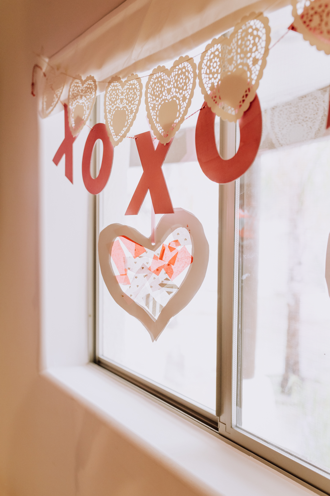 fun and easy valentine's day suncatcher craft with kids | thelovedesignedlife.com #craftwithkids #kidscraft #valentinescraft #hearts