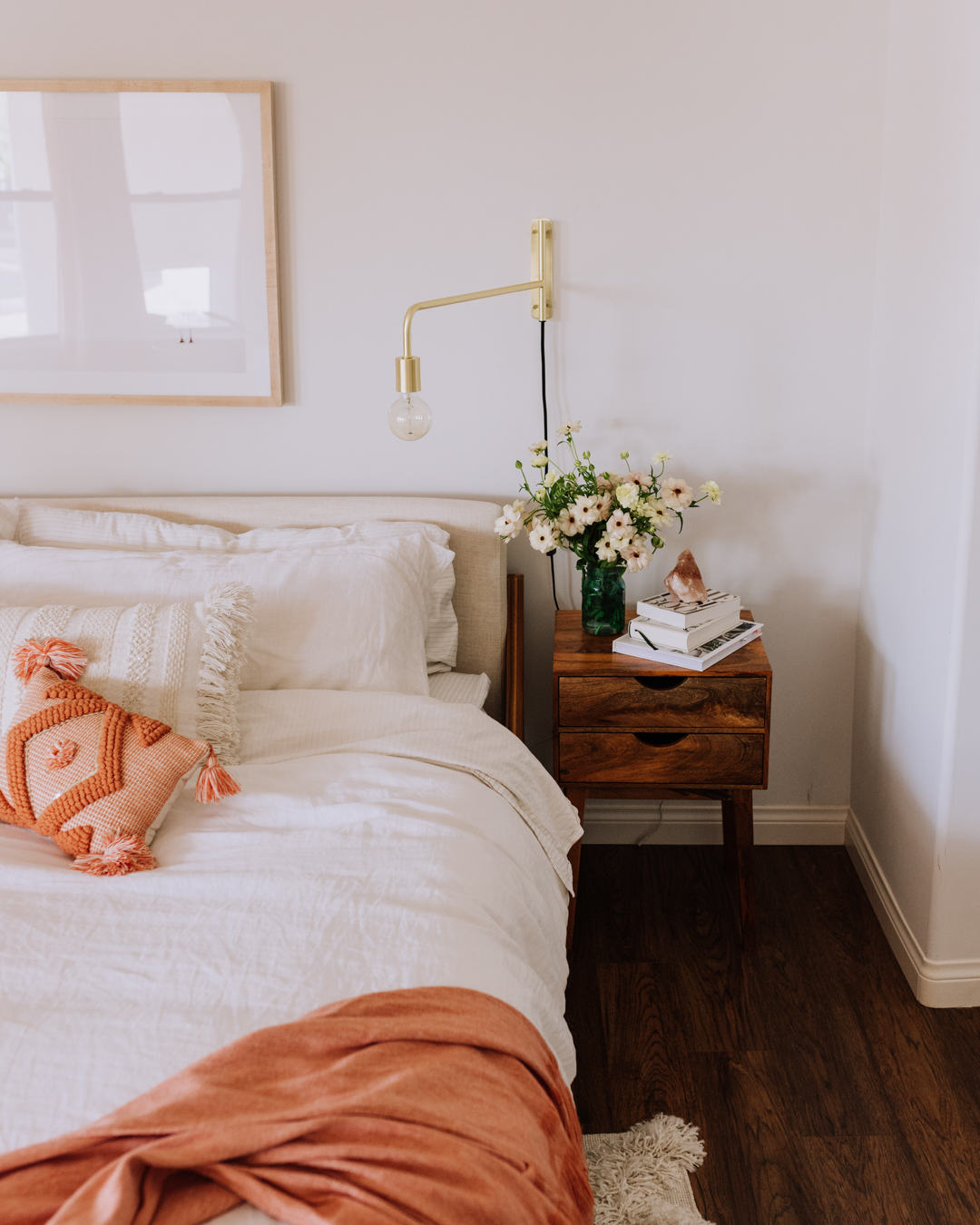 a bed made to start the day, and flowers on the nightstand! | thelovedesignedlife.com #bedrrom #morningroutine