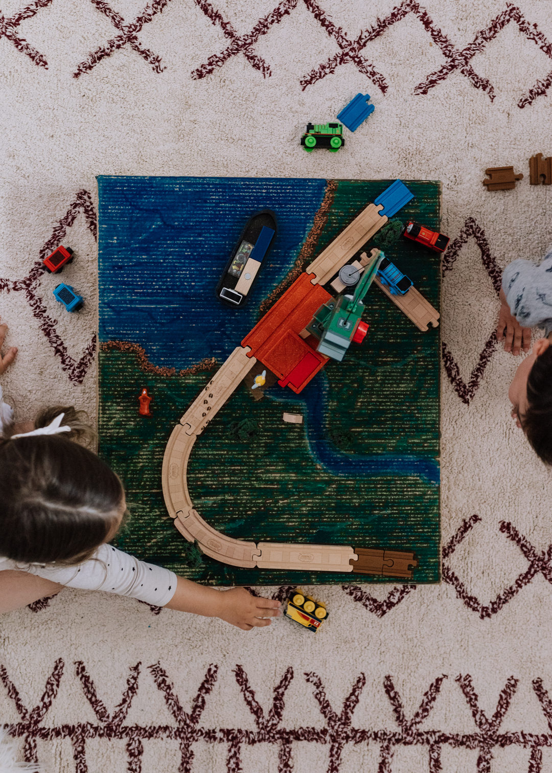 #AD When you don't want a big train table taking up space, and you have some leftover cardboard to recycle, you create your own little DIY cardboard train table for all of your favorite Thomas & Friends™ Track & Engines characters! We've partnered with Thomas & Friends™ to check out these adorable, high quality wooden trains & tracks and the kids LOVED them. More about the trains, tracks, and how we created this DIY train table are on the blog! thelovedesignedlife.com #ThomasandFriends #ThomasWood @fisherprice 