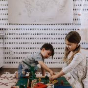 the kids playing with their finished creation | thelovedesignedlife.com #thomasthetrain #cardbaorddiy