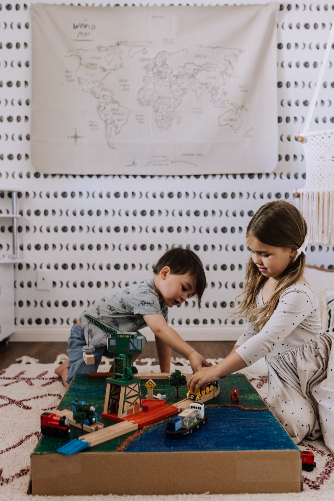 the kids playing with their finished creation | thelovedesignedlife.com #thomasthetrain #cardbaorddiy