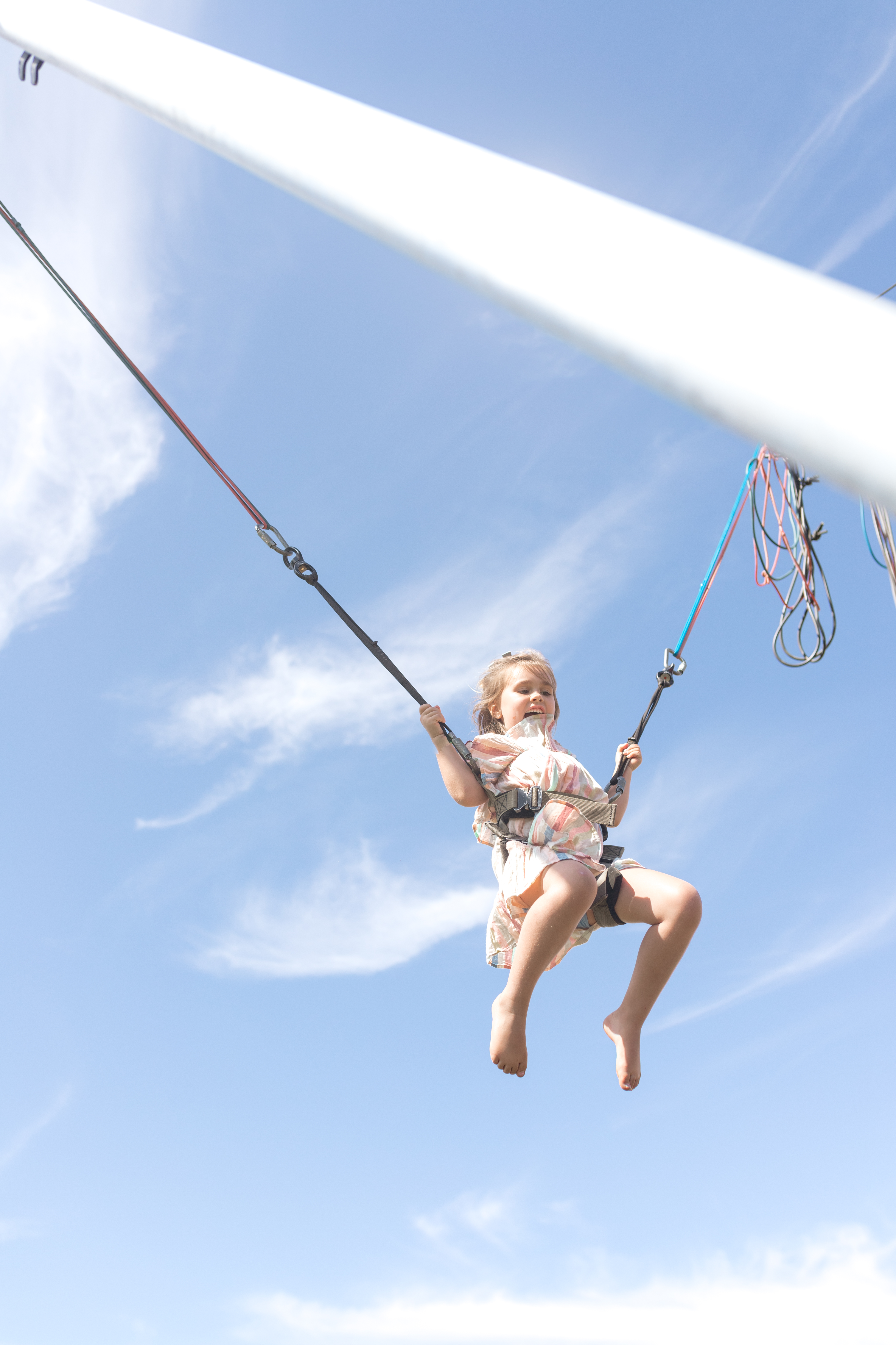 little girl on bungee trampoline ride