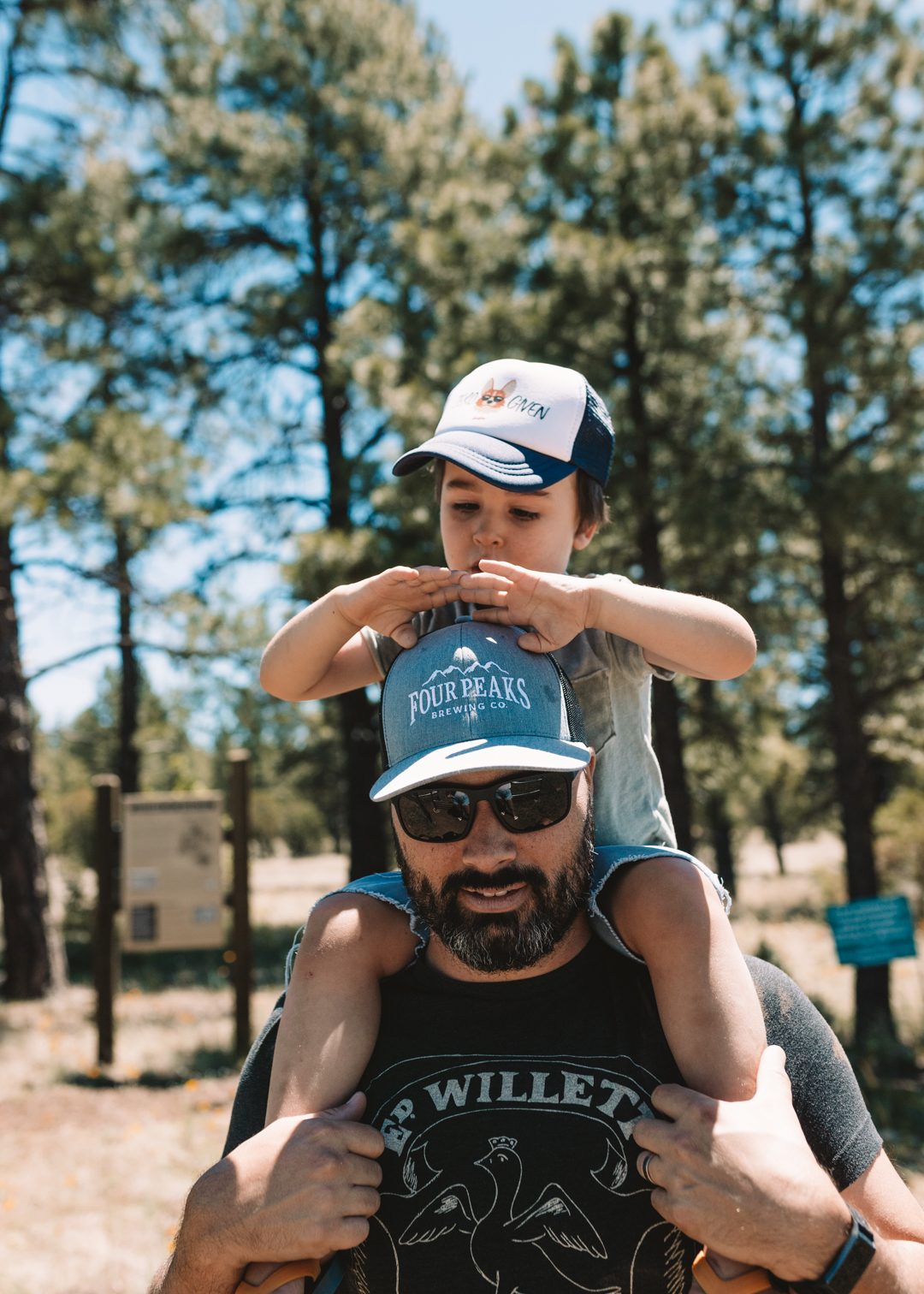 dad with son on shoulders