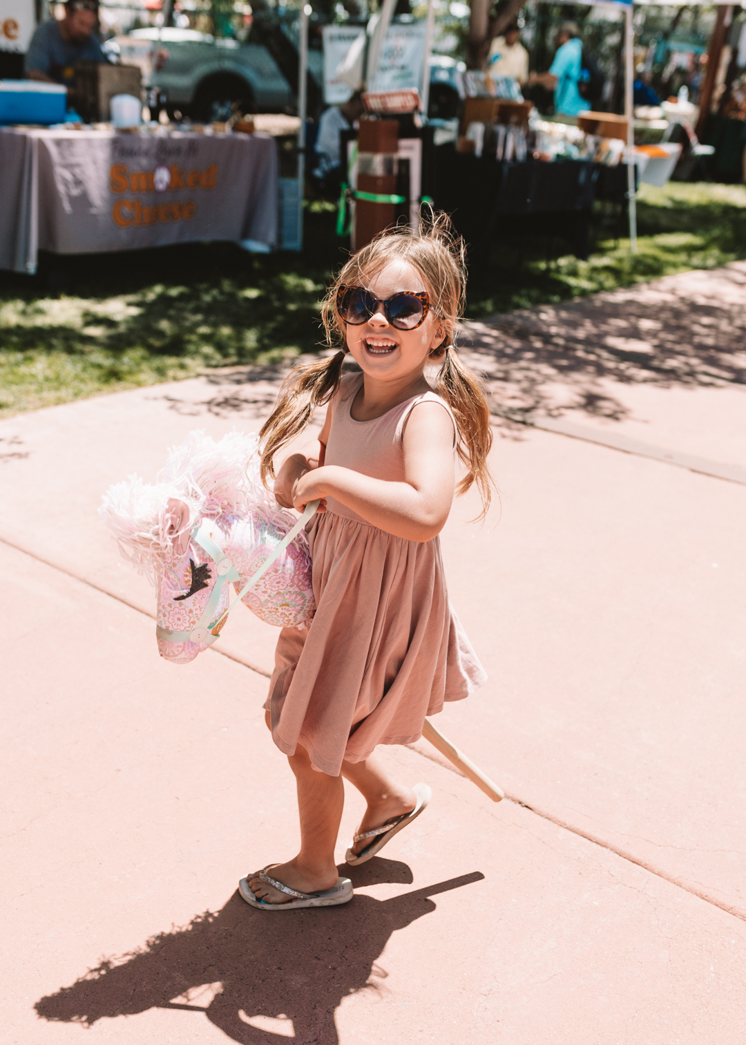 little girl riding a hobby horse toy