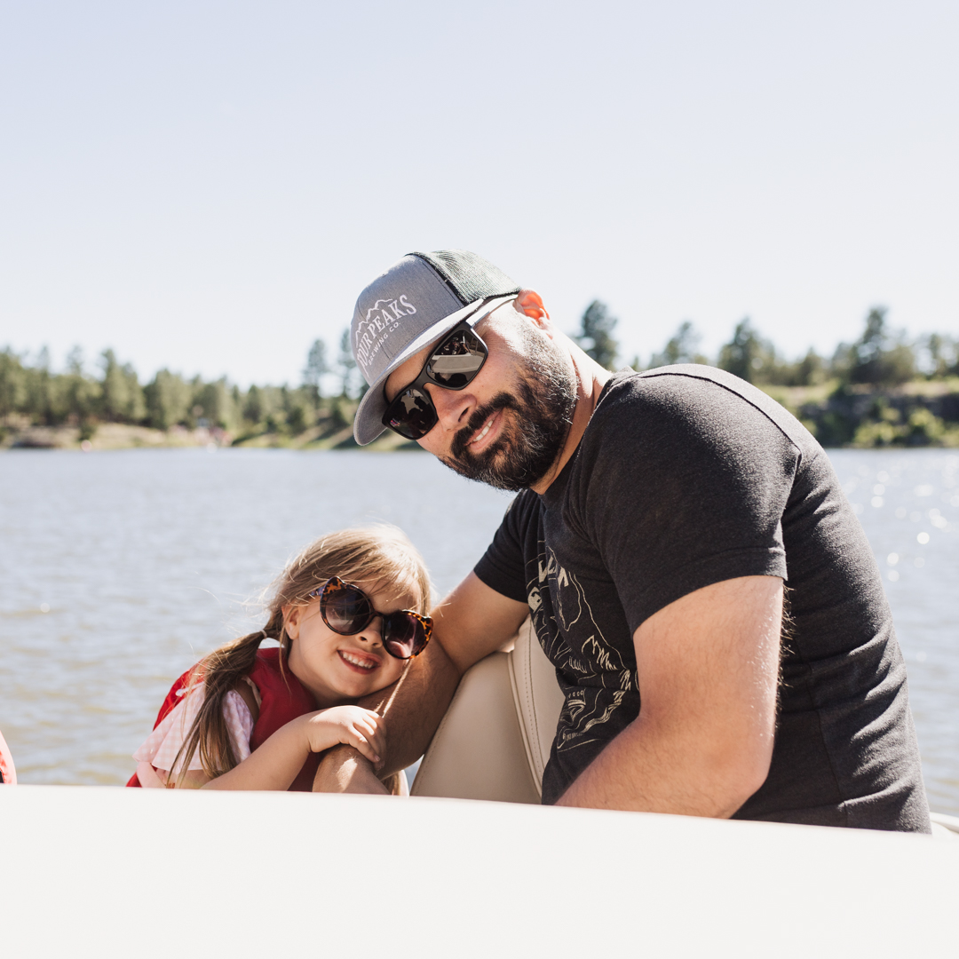 dad and daughter on a boat