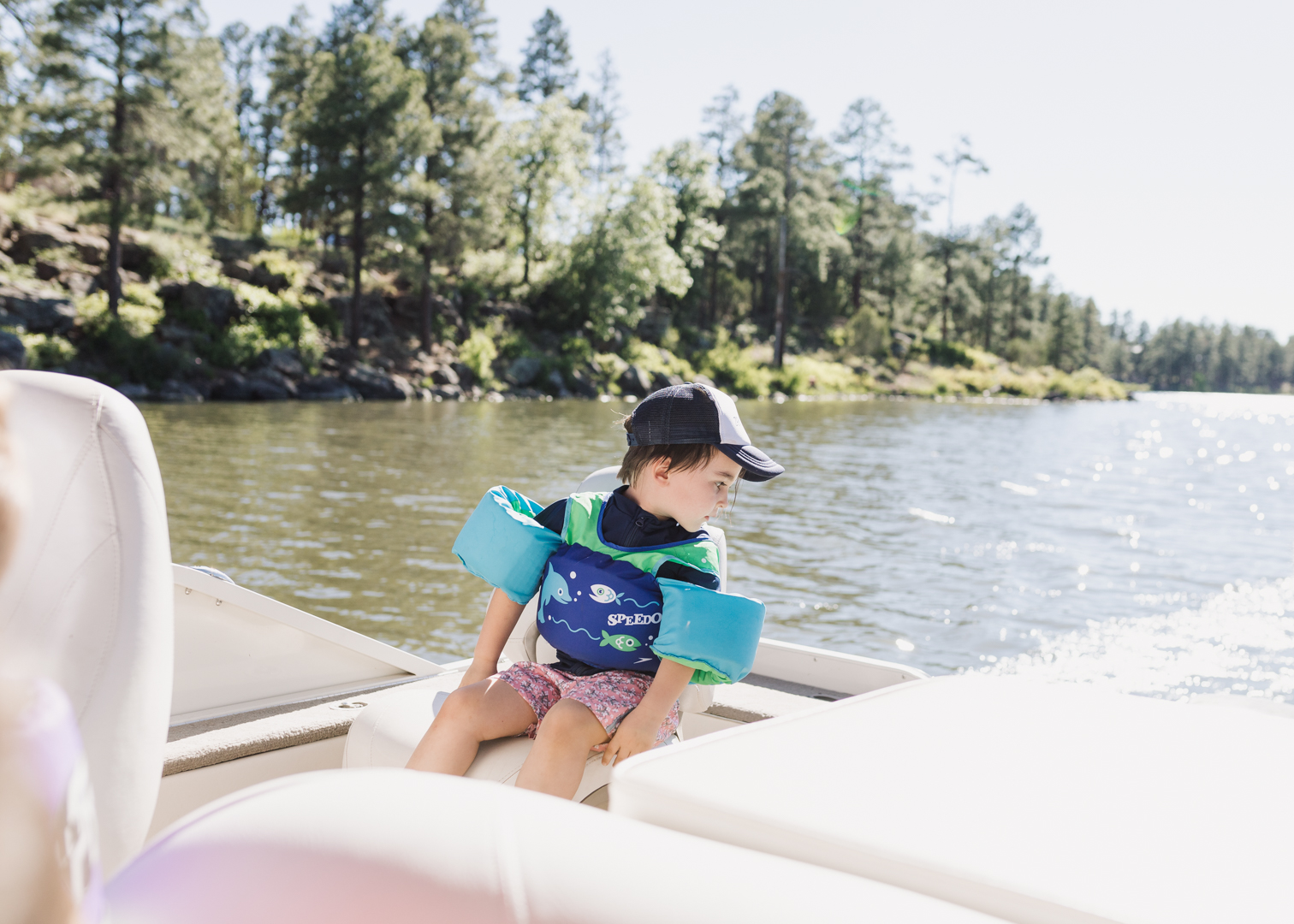 little boy on a pontoon boat