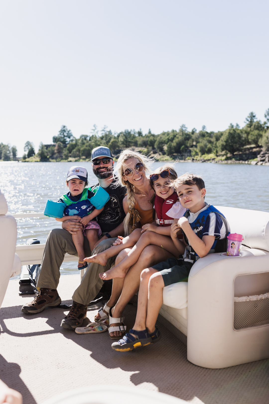 family of 5 on a pontoon boat