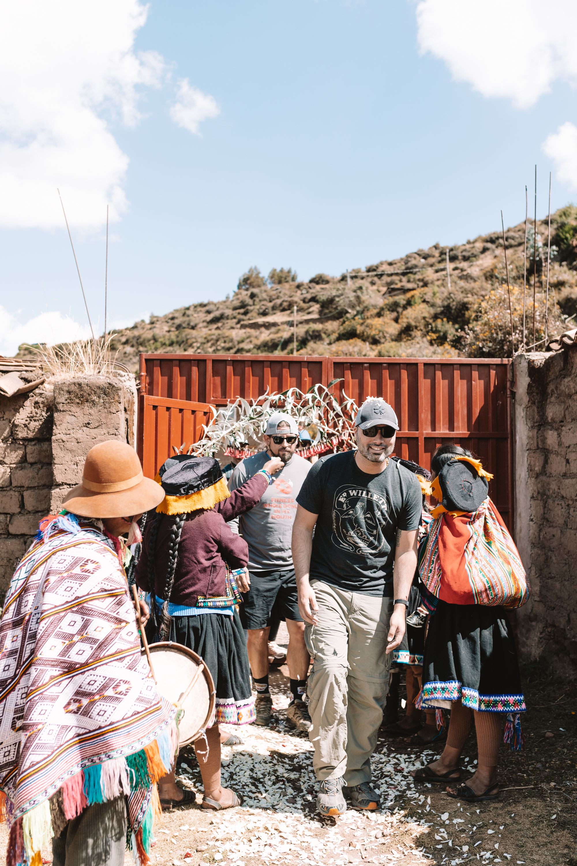 arriving at the school in the Andean Mountains and being greeted by a traditional ceremony and flower petals thrown on our heads #peruretreat #wanderlust #travel