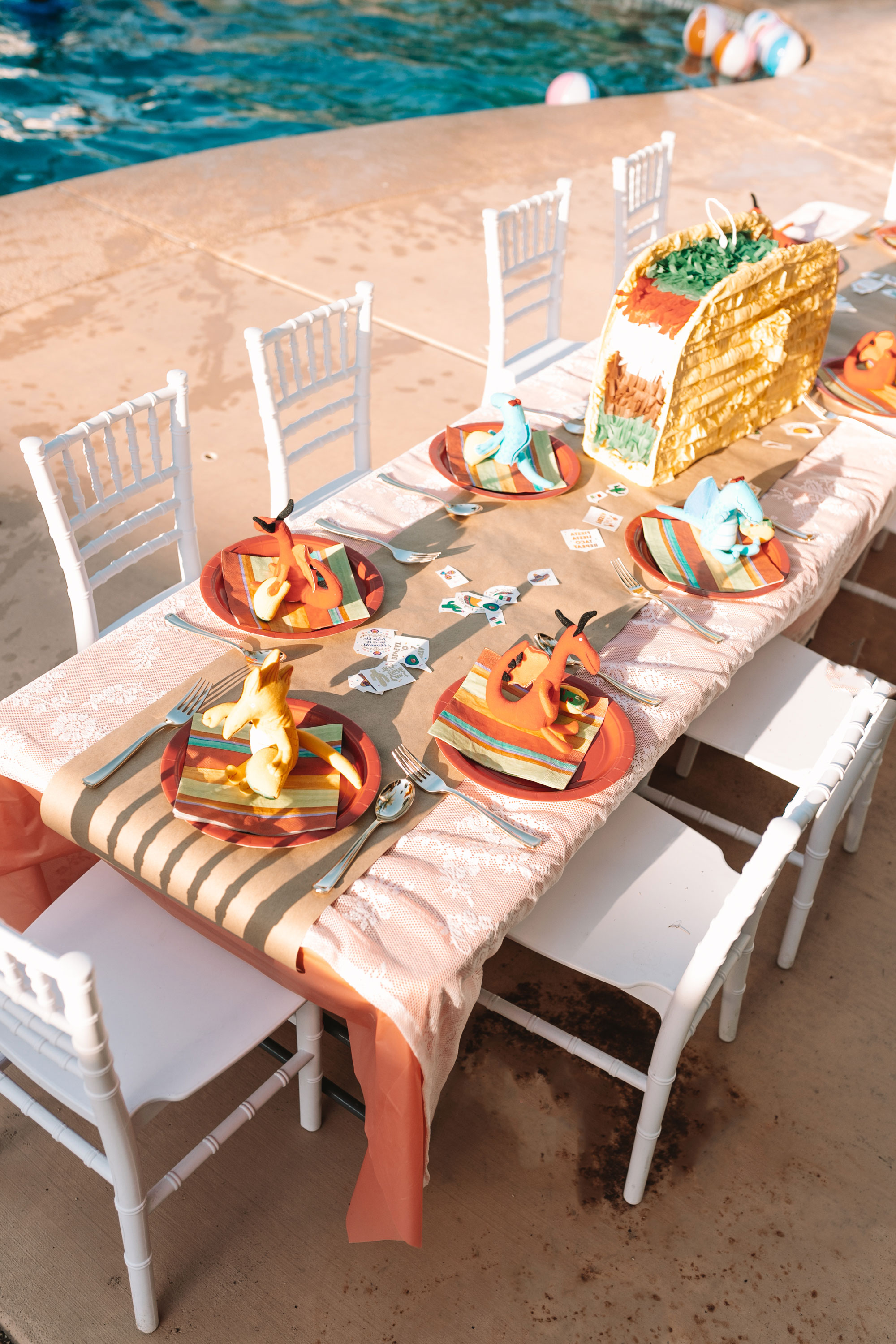 the kid's table all set up for a taco party.